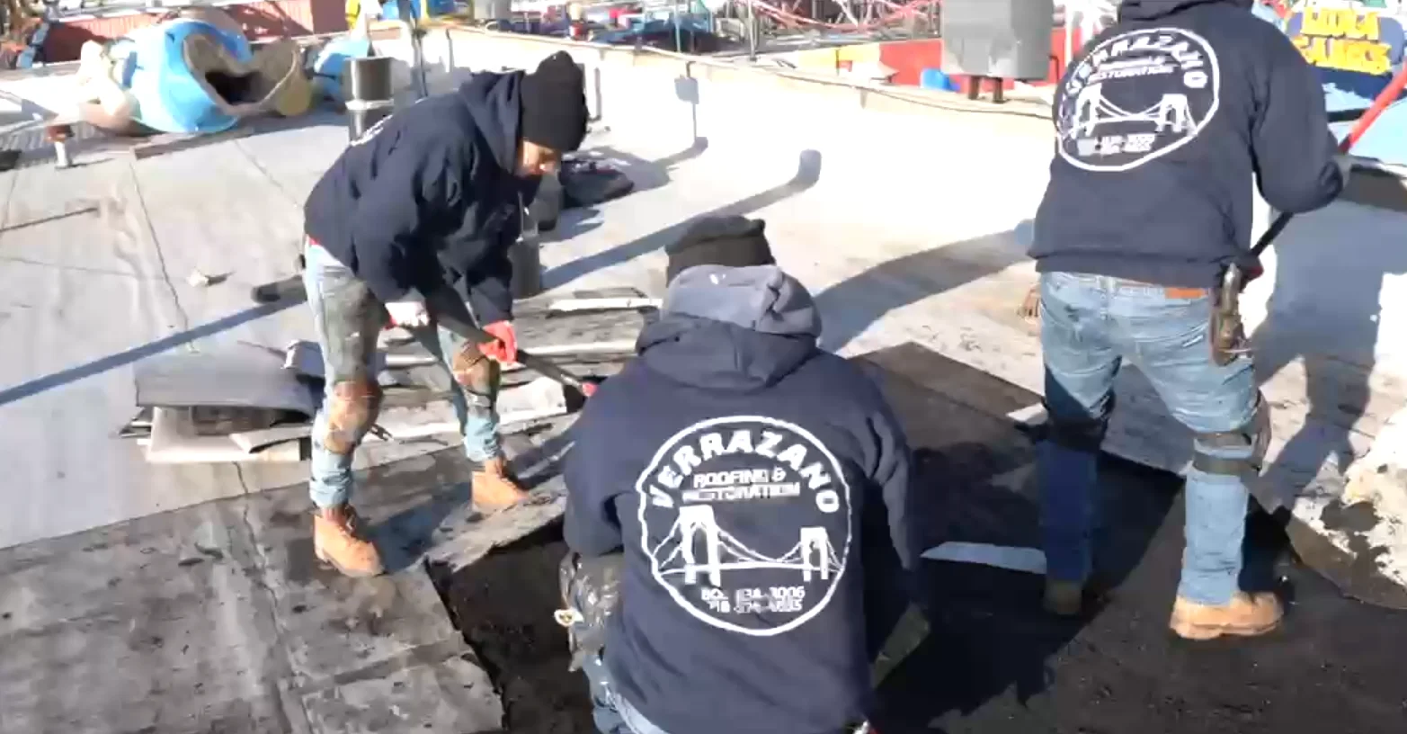 Verrazano roofers preparing a roof surface together