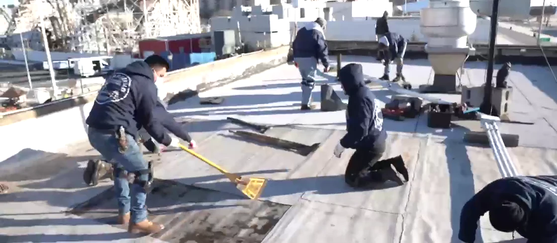 Verrazano’s crew working on a New York rooftop